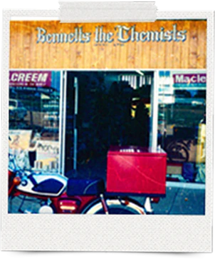 An archive photo of the original Bennetts the Chemists shop front, with its wooden sign above the windows