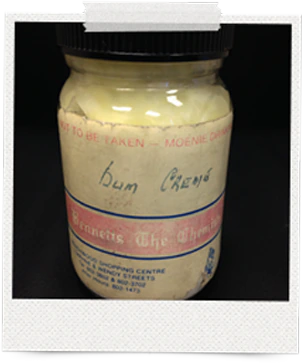 An archive photo of the original Bum Crème in a glass jar, its Bennetts the Chemists label written by hand